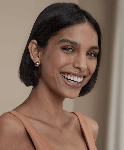 A portrait of a woman with short hair smiling 